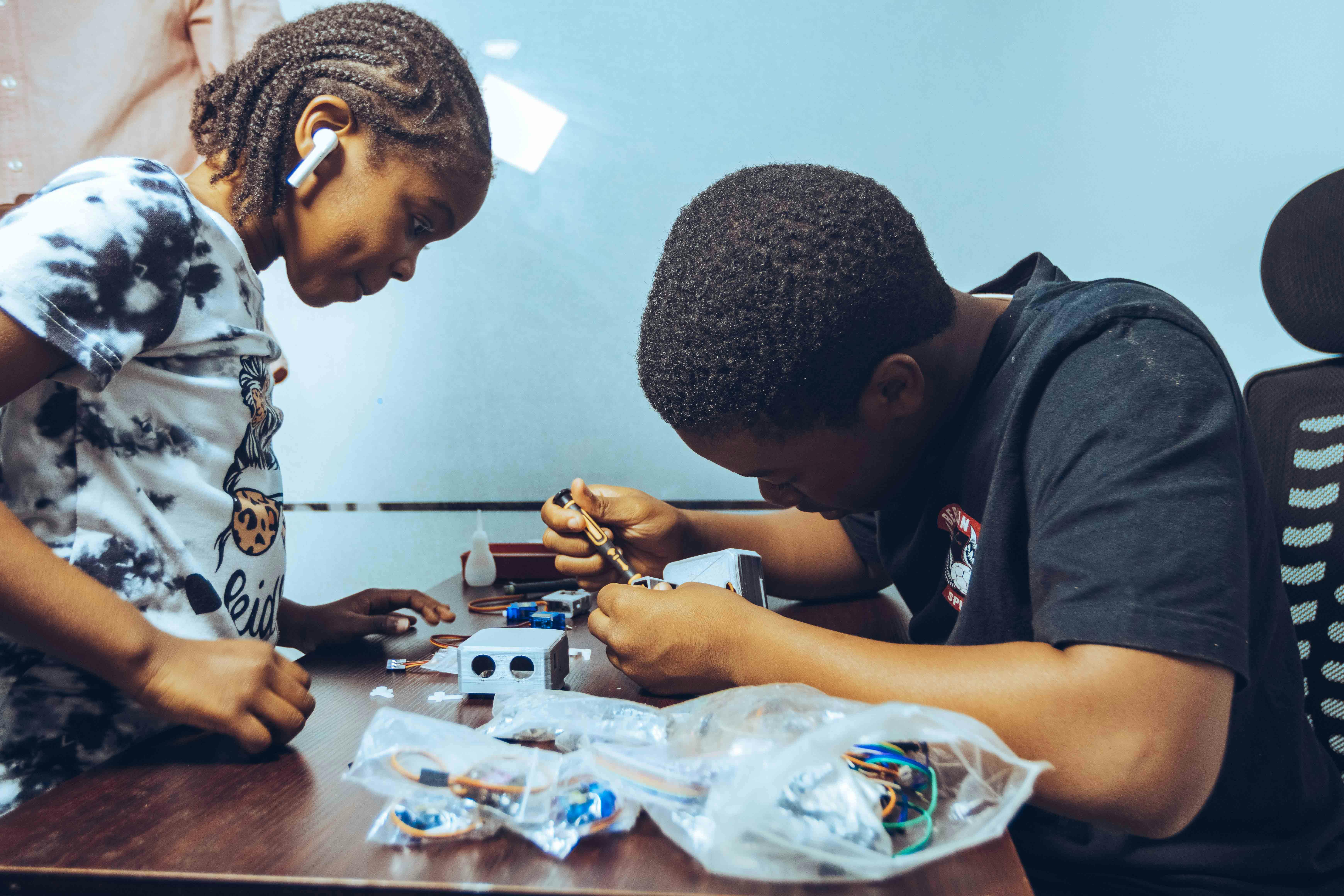 Nigerian students engaged in collaborative learning and hands-on project work